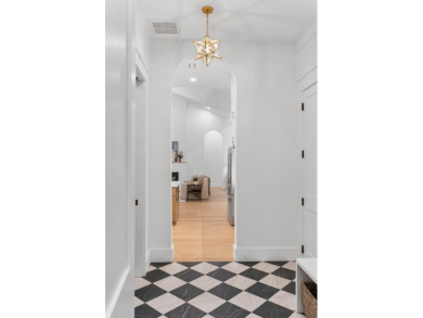This stunning NEW CONSTRUCTION home Wild Heron is a single level on Sharks Tooth Golf Club in Florida - for sale on GolfHomes.com, golf home, golf lot