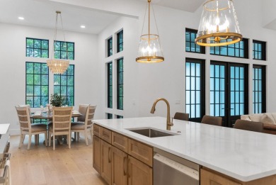 This stunning NEW CONSTRUCTION home Wild Heron is a single level on Sharks Tooth Golf Club in Florida - for sale on GolfHomes.com, golf home, golf lot