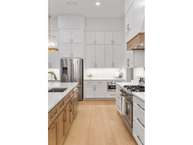 This stunning NEW CONSTRUCTION home Wild Heron is a single level on Sharks Tooth Golf Club in Florida - for sale on GolfHomes.com, golf home, golf lot