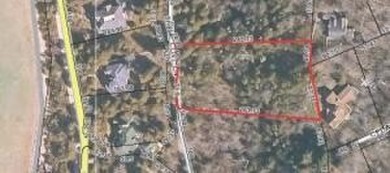 This large secluded wooded lot on a quiet street is surrounded on The Jewel Golf Course in Michigan - for sale on GolfHomes.com, golf home, golf lot