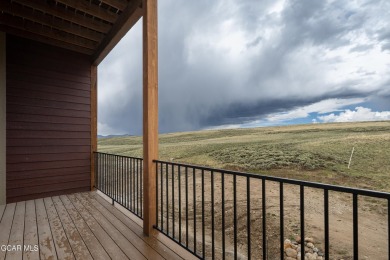 Tucked against a serene hillside in the coveted Grand Elk golf on Grand Elk Ranch and Club in Colorado - for sale on GolfHomes.com, golf home, golf lot