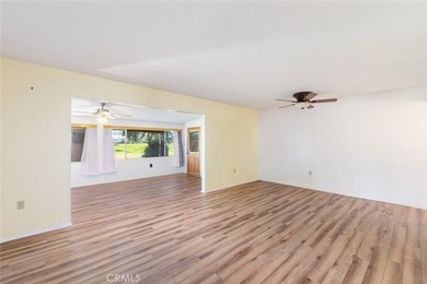 Inviting 55+ end-unit home located in the heart of Menifee on Cherry Hills Golf Club in California - for sale on GolfHomes.com, golf home, golf lot