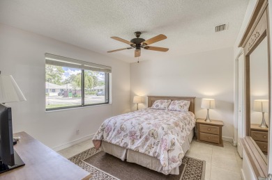 Located in the highly desirable Club Cottages community within on PGA National Golf Club in Florida - for sale on GolfHomes.com, golf home, golf lot
