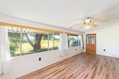 Inviting 55+ end-unit home located in the heart of Menifee on Cherry Hills Golf Club in California - for sale on GolfHomes.com, golf home, golf lot