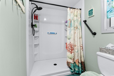 Welcome to a charming 3-bedroom, 2-bathroom home nestled in the on Barefoot Resort and Golf Club  in South Carolina - for sale on GolfHomes.com, golf home, golf lot