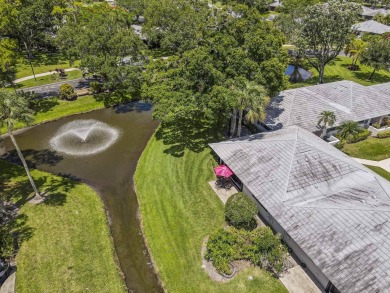 Located in the highly desirable Club Cottages community within on PGA National Golf Club in Florida - for sale on GolfHomes.com, golf home, golf lot