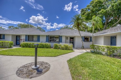 Located in the highly desirable Club Cottages community within on PGA National Golf Club in Florida - for sale on GolfHomes.com, golf home, golf lot