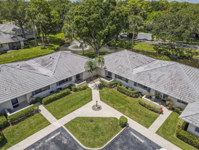 Located in the highly desirable Club Cottages community within on PGA National Golf Club in Florida - for sale on GolfHomes.com, golf home, golf lot