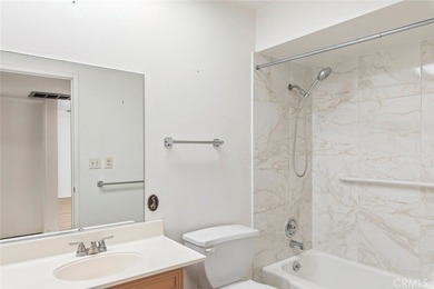 Inviting 55+ end-unit home located in the heart of Menifee on Cherry Hills Golf Club in California - for sale on GolfHomes.com, golf home, golf lot