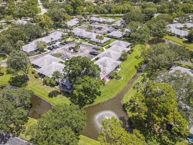 Located in the highly desirable Club Cottages community within on PGA National Golf Club in Florida - for sale on GolfHomes.com, golf home, golf lot