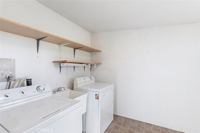 Inviting 55+ end-unit home located in the heart of Menifee on Cherry Hills Golf Club in California - for sale on GolfHomes.com, golf home, golf lot