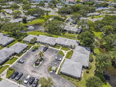 Located in the highly desirable Club Cottages community within on PGA National Golf Club in Florida - for sale on GolfHomes.com, golf home, golf lot