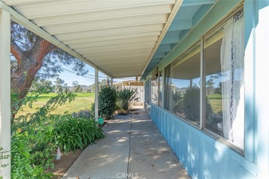 Inviting 55+ end-unit home located in the heart of Menifee on Cherry Hills Golf Club in California - for sale on GolfHomes.com, golf home, golf lot