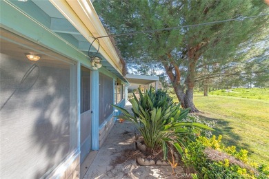Inviting 55+ end-unit home located in the heart of Menifee on Cherry Hills Golf Club in California - for sale on GolfHomes.com, golf home, golf lot