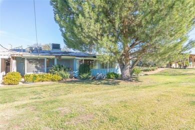 Inviting 55+ end-unit home located in the heart of Menifee on Cherry Hills Golf Club in California - for sale on GolfHomes.com, golf home, golf lot