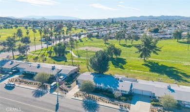 Inviting 55+ end-unit home located in the heart of Menifee on Cherry Hills Golf Club in California - for sale on GolfHomes.com, golf home, golf lot