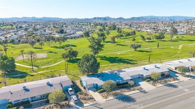 Inviting 55+ end-unit home located in the heart of Menifee on Cherry Hills Golf Club in California - for sale on GolfHomes.com, golf home, golf lot
