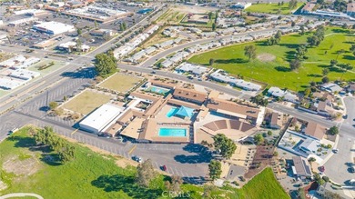 Inviting 55+ end-unit home located in the heart of Menifee on Cherry Hills Golf Club in California - for sale on GolfHomes.com, golf home, golf lot