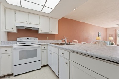 Move-in ready, turn-key 2 bedroom + den, 2 bathroom end-unit on Lehigh Resort Club in Florida - for sale on GolfHomes.com, golf home, golf lot