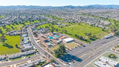 Inviting 55+ end-unit home located in the heart of Menifee on Cherry Hills Golf Club in California - for sale on GolfHomes.com, golf home, golf lot