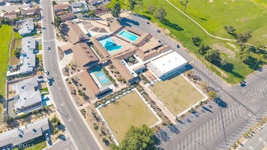 Inviting 55+ end-unit home located in the heart of Menifee on Cherry Hills Golf Club in California - for sale on GolfHomes.com, golf home, golf lot