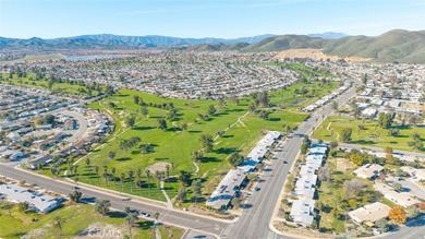 Inviting 55+ end-unit home located in the heart of Menifee on Cherry Hills Golf Club in California - for sale on GolfHomes.com, golf home, golf lot