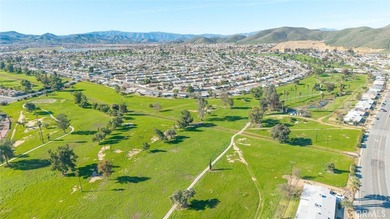 Inviting 55+ end-unit home located in the heart of Menifee on Cherry Hills Golf Club in California - for sale on GolfHomes.com, golf home, golf lot