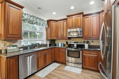 Just steps from top-rated Binks Forest Elementary, this on Binks Forest Golf Club in Florida - for sale on GolfHomes.com, golf home, golf lot