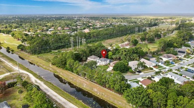 Just steps from top-rated Binks Forest Elementary, this on Binks Forest Golf Club in Florida - for sale on GolfHomes.com, golf home, golf lot