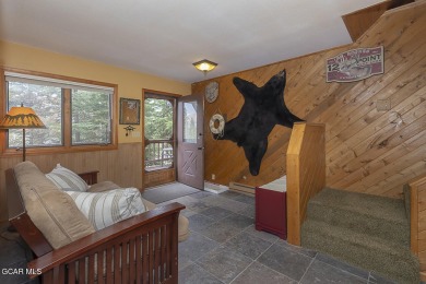 Rustic Cabin Retreat with Lake & Mountain Views in Columbine on Grand Lake Golf Course in Colorado - for sale on GolfHomes.com, golf home, golf lot