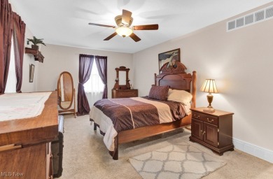 Welcome to this beautifully updated home nestled on a serene on Lake Mohawk Golf Club in Ohio - for sale on GolfHomes.com, golf home, golf lot
