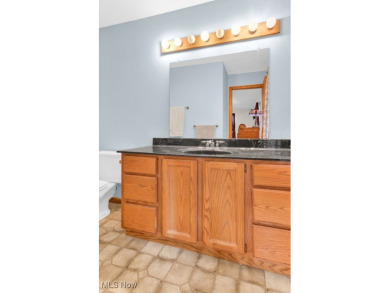 Welcome to this beautifully updated home nestled on a serene on Lake Mohawk Golf Club in Ohio - for sale on GolfHomes.com, golf home, golf lot