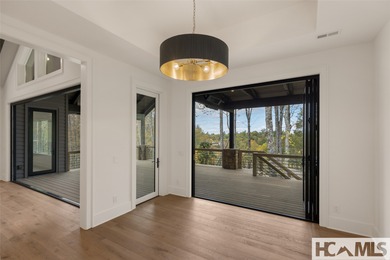 Nestled within the gates of Wildcat Cliffs Country Club but part on Wildcat Cliffs Country Club in North Carolina - for sale on GolfHomes.com, golf home, golf lot