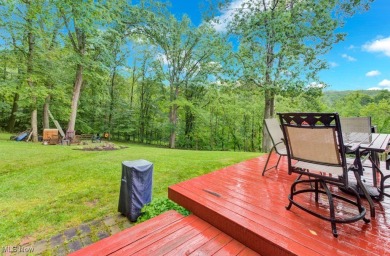 Welcome to this beautifully updated home nestled on a serene on Lake Mohawk Golf Club in Ohio - for sale on GolfHomes.com, golf home, golf lot
