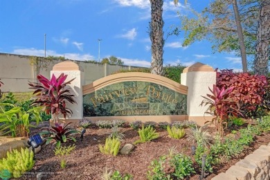 Rarely available corner villa in the exclusive, gated community on Palm-Aire Country Club and Resort - The Oaks in Florida - for sale on GolfHomes.com, golf home, golf lot