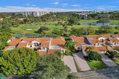 Rarely available corner villa in the exclusive, gated community on Palm-Aire Country Club and Resort - The Oaks in Florida - for sale on GolfHomes.com, golf home, golf lot