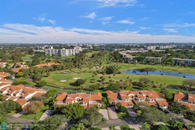 Rarely available corner villa in the exclusive, gated community on Palm-Aire Country Club and Resort - The Oaks in Florida - for sale on GolfHomes.com, golf home, golf lot