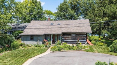 Beautiful lakefront log home located at Crooked Lake. This 4 on Crooked Lake Golf Course Whitley County in Indiana - for sale on GolfHomes.com, golf home, golf lot
