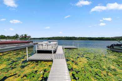 Beautiful lakefront log home located at Crooked Lake. This 4 on Crooked Lake Golf Course Whitley County in Indiana - for sale on GolfHomes.com, golf home, golf lot