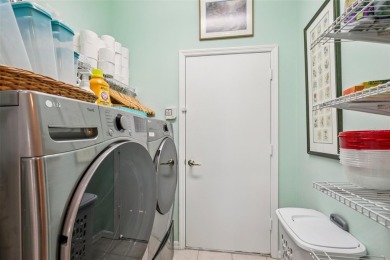 Meticulously maintained and lovingly cared for, rare end-unit on Pelican Pointe Golf and Country Club in Florida - for sale on GolfHomes.com, golf home, golf lot