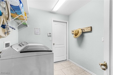 Discover pristine waterfront living in this exceptional on Burnt Store Golf Club in Florida - for sale on GolfHomes.com, golf home, golf lot