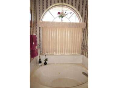 Impressive WATERFRONT 3 Bedroom, 2.5 Bathroom home with attached on Saint Andrews South Golf Club in Florida - for sale on GolfHomes.com, golf home, golf lot