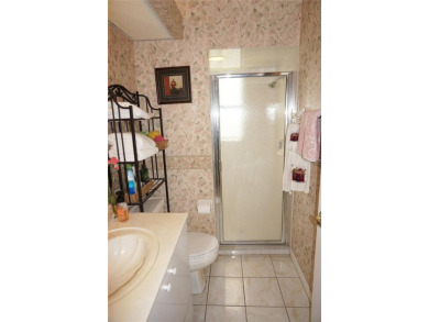 Impressive WATERFRONT 3 Bedroom, 2.5 Bathroom home with attached on Saint Andrews South Golf Club in Florida - for sale on GolfHomes.com, golf home, golf lot