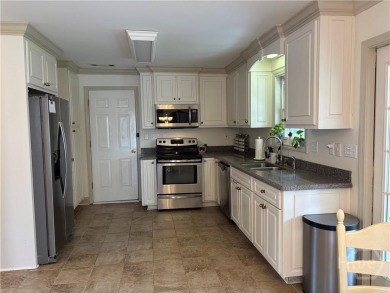 Enjoy life in this beautiful all-brick, low maintenance home in on Jennings Mill Country Club in Georgia - for sale on GolfHomes.com, golf home, golf lot
