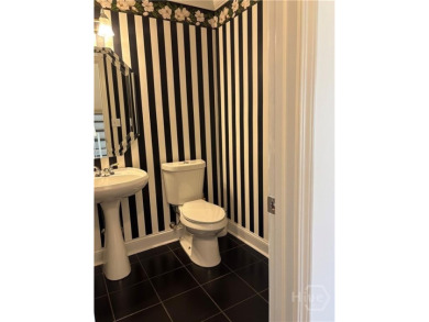 Enjoy life in this beautiful all-brick, low maintenance home in on Jennings Mill Country Club in Georgia - for sale on GolfHomes.com, golf home, golf lot