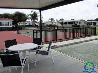 "Beautifully updated cottage-style home located in The on Hamptons Golf Club in Florida - for sale on GolfHomes.com, golf home, golf lot