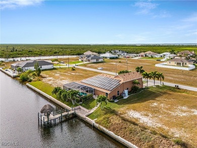 Discover pristine waterfront living in this exceptional on Burnt Store Golf Club in Florida - for sale on GolfHomes.com, golf home, golf lot