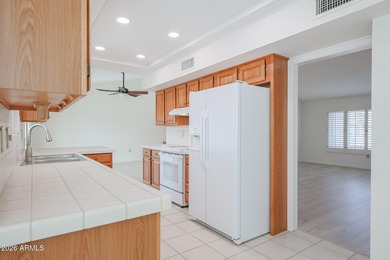 This well-maintained Capistrano offers vaulted ceilings that on Echo Mesa Golf Course in Arizona - for sale on GolfHomes.com, golf home, golf lot