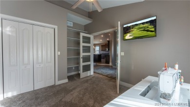 This exceptional residence has a wall of windows providing a on Osage National Golf Club in Missouri - for sale on GolfHomes.com, golf home, golf lot