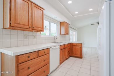 This well-maintained Capistrano offers vaulted ceilings that on Echo Mesa Golf Course in Arizona - for sale on GolfHomes.com, golf home, golf lot